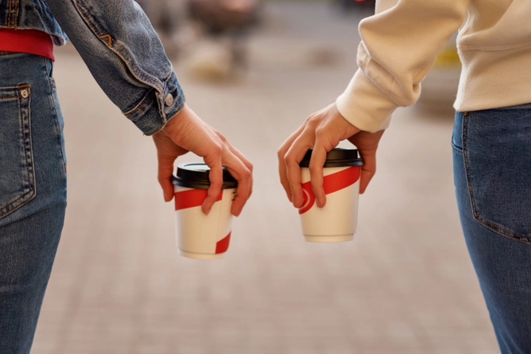 Are we a Great Fit for Each Other 3 Two women walking with to go cups of coffee